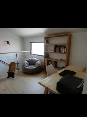 Coin salon dans l'établissement Maison cosy proche forêt