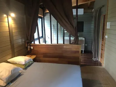 Un ou plusieurs lits dans un hébergement de l'établissement Villa de l'océan
