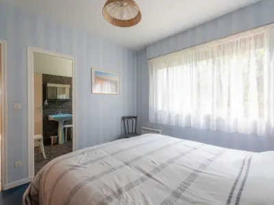 Un ou plusieurs lits dans un hébergement de l'établissement Maison familiale 5 chambres pour 14 pers, vue lac à Biscarrosse - FR-1-319-605