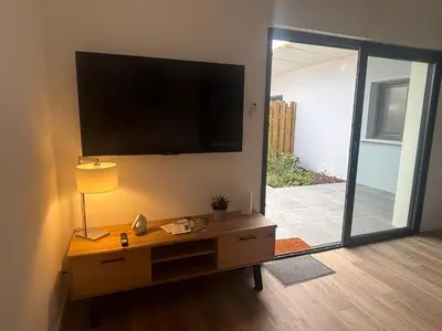 Télévision ou salle de divertissement dans l'établissement DACSE-VILLAGE - Gite 01