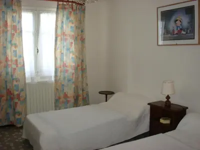 Un ou plusieurs lits dans un hébergement de l'établissement Appartement à Capbreton en bordure de forêt