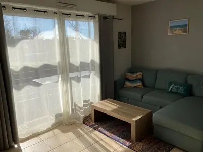 Coin salon dans l'établissement Appartement cosy au calme à Léon