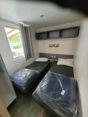 Un ou plusieurs lits dans un hébergement de l'établissement mobil home