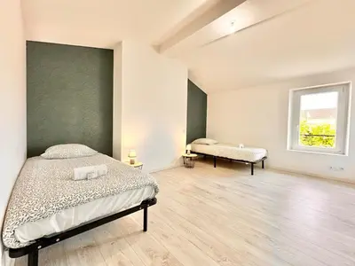 Un ou plusieurs lits dans un hébergement de l'établissement L'Orangerie Urbaine central