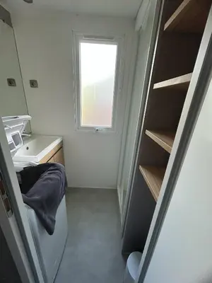 Un ou plusieurs lits dans un hébergement de l'établissement Mobilhome sur camping 4 étoiles