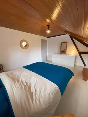 Un ou plusieurs lits dans un hébergement de l'établissement Maison calme et chaleureuse au coeur du Béarn