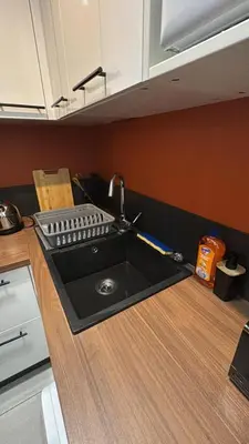 Cuisine ou kitchenette dans l'établissement DaxLodge T3 cosy