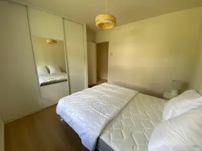 Un ou plusieurs lits dans un hébergement de l'établissement Les Nids de Galleben - La Villa Mimizan
