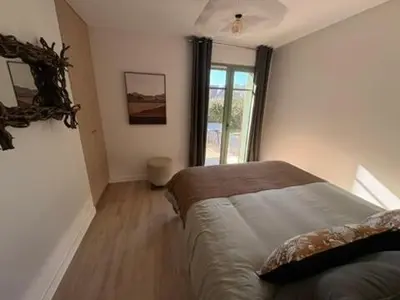 Un ou plusieurs lits dans un hébergement de l'établissement Villa rénovée sur Bassin d'Arcachon