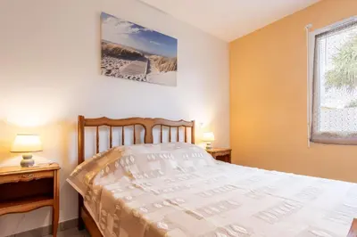 Un ou plusieurs lits dans un hébergement de l'établissement Maison 3 chambres Biscarrosse Bourg proche centre ville