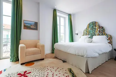 Un ou plusieurs lits dans un hébergement de l'établissement Hotel du Balcon