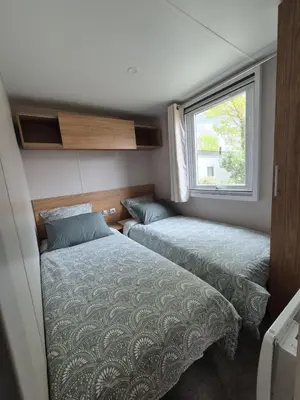 Un ou plusieurs lits dans un hébergement de l'établissement MOBIL HOME BISCAROSSE LAC - Loc du Samedi au Samedi uniquement