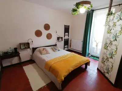 Un ou plusieurs lits dans un hébergement de l'établissement Chambre d'hôtes 2 - Exotique - Un Refuge à Cachen