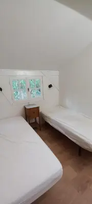Un ou plusieurs lits dans un hébergement de l'établissement Maison de vacances de famille sous les pins