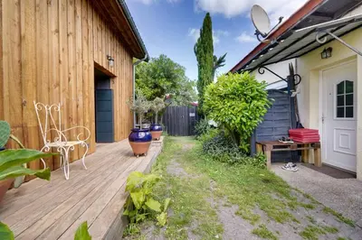 Jardin de l'établissement La maison du port – Maison avec piscine à La Teste