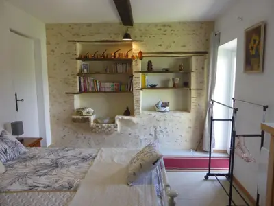 Un ou plusieurs lits dans un hébergement de l'établissement Chambre d'hôte Les Papillons - Chez Gilles et Myriam