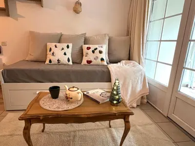 Coin salon dans l'établissement Joli appartement au golf