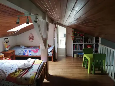 Un ou plusieurs lits dans un hébergement de l'établissement Maison familiale au calme avec piscine en bordure de forêt