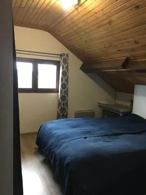 Un ou plusieurs lits dans un hébergement de l'établissement Maison Chez Loulou