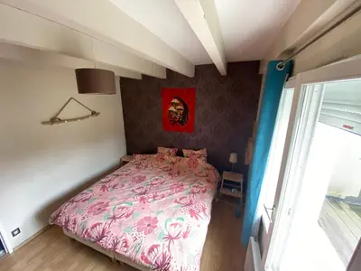 Un ou plusieurs lits dans un hébergement de l'établissement Appartement entre terre et océan