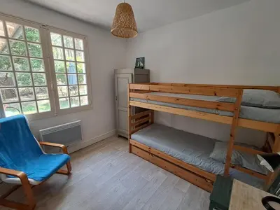 Un ou plusieurs lits dans un hébergement de l'établissement Savannah - La maison des pins