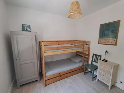 Un ou plusieurs lits dans un hébergement de l'établissement Savannah - La maison des pins
