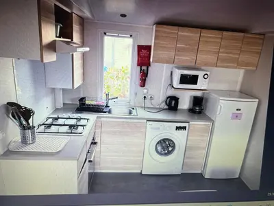 Cuisine ou kitchenette dans l'établissement Au Paradis