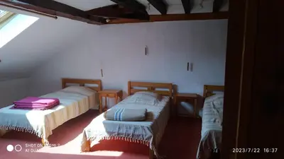 Un ou plusieurs lits dans un hébergement de l'établissement Maison de maître