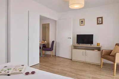 Télévision ou salle de divertissement dans l'établissement Quality Aparthotel Mont-de-Marsan