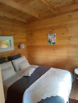 Un ou plusieurs lits dans un hébergement de l'établissement Chalet du bonheur