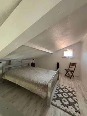 Un ou plusieurs lits dans un hébergement de l'établissement Les Cottages 1 - Appartement au bord de l'océan