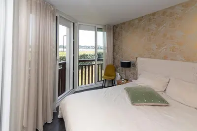 Un ou plusieurs lits dans un hébergement de l'établissement Appartement Lac marin