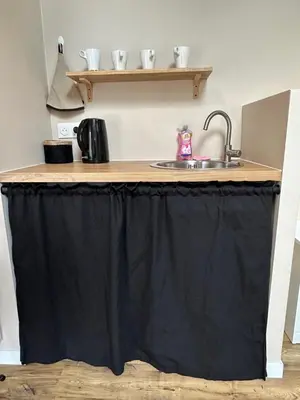 Cuisine ou kitchenette dans l'établissement Le petit Arrigade