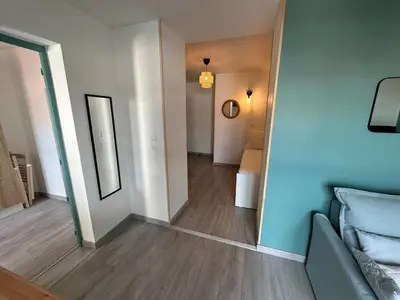 Un ou plusieurs lits dans un hébergement de l'établissement Appartement rénové et lumineux - 130