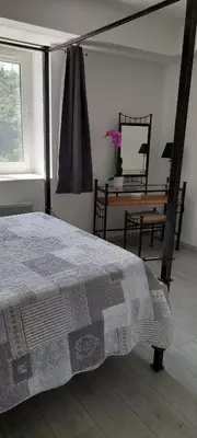 Un ou plusieurs lits dans un hébergement de l'établissement Le Trianon de Salies