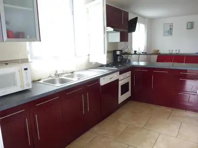 Cuisine ou kitchenette dans l'établissement Appartement de 2 chambres en rez-de-chaussée d'une maison