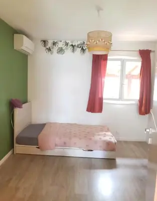 Un ou plusieurs lits dans un hébergement de l'établissement Maison familiale à 6 minutes de l'océan 4 chambres