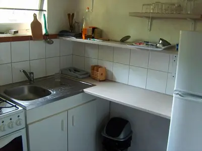 Cuisine ou kitchenette dans l'établissement Chalet au coeur d'un parc de 4 ha