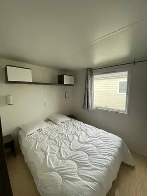 Un ou plusieurs lits dans un hébergement de l'établissement Mobile home à Mimizan