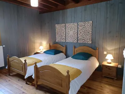 Un ou plusieurs lits dans un hébergement de l'établissement Moulin de Sore -Gîtes 14 pers et chambres d'hôtes dans un lieu naturel préservé