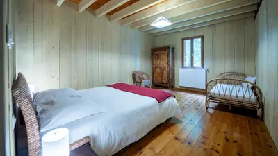 Un ou plusieurs lits dans un hébergement de l'établissement Moulin de Sore -Gîtes 14 pers et chambres d'hôtes dans un lieu naturel préservé
