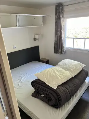 Un ou plusieurs lits dans un hébergement de l'établissement Camping 4 étoiles Mobile home 4 à 6 personnes