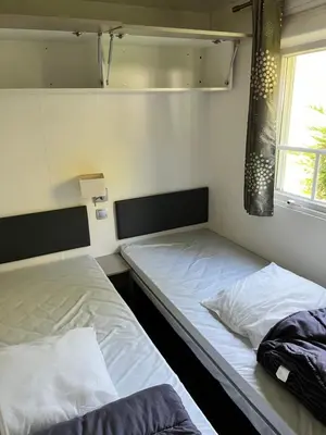 Un ou plusieurs lits dans un hébergement de l'établissement Camping 4 étoiles Mobile home 4 à 6 personnes