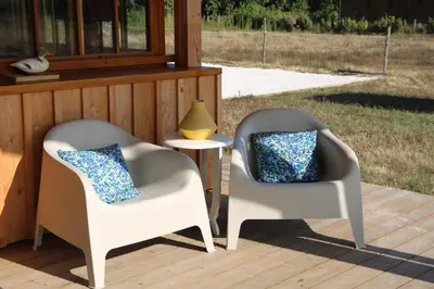 Coin salon dans l'établissement Maison bois Lesbats
