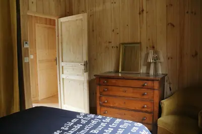 Un ou plusieurs lits dans un hébergement de l'établissement Maison bois Lesbats