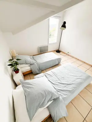 Un ou plusieurs lits dans un hébergement de l'établissement Capbreton à pied tout simple