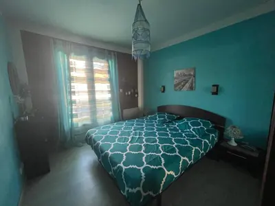 Un ou plusieurs lits dans un hébergement de l'établissement Maison familiale avec piscine