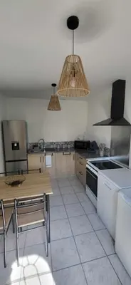 Cuisine ou kitchenette dans l'établissement La Rose des Landes