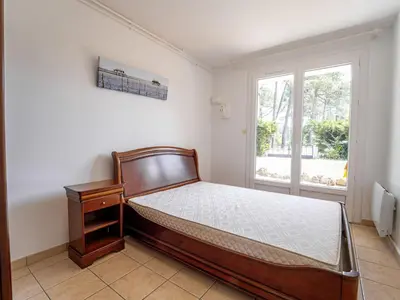 Un ou plusieurs lits dans un hébergement de l'établissement Appartement calme entre courant et océan, 4 personnes, terrasse - FR-1-50-189