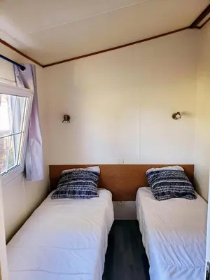 Un ou plusieurs lits dans un hébergement de l'établissement Mobilhome vue sur la lande